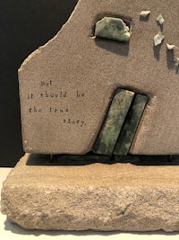 a sculpture with a quote on it