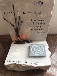 a sculpture with a quote that says, i have been kind