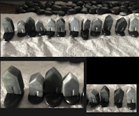 a row of black and white stones on a table